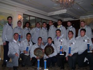 The 2011 St. Francis Prep Varsity Handball Team with the team's coaching staff display their Championship Jackets, 1st place trophies, and C.H.S.A.A. Championship plaques at their Awards Dinner on July 20. Photo by Maria Luna.