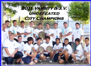 2011 SFP Varsity and J.V. Undefeated C.H.S.A.A. City Champions display their championship awards after Varsity defeated McClancy 4-1 and J.V. crushing Molloy 3-0 at Orchard Beach on June 6, 2011. The J.V. Team was not only Undefeated in match play, but also Perfect by winning all 39 games played. Photo by Mr. Frank Milano